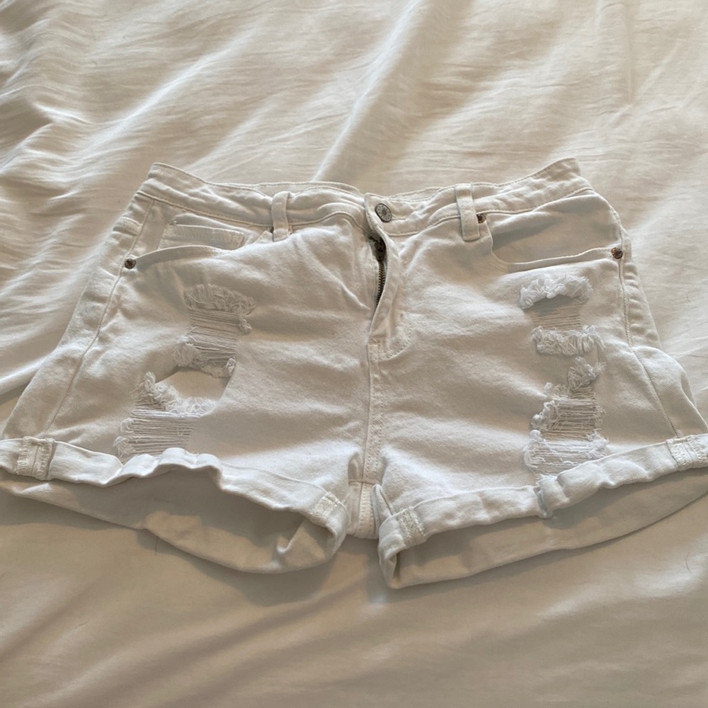 White ripped shorts